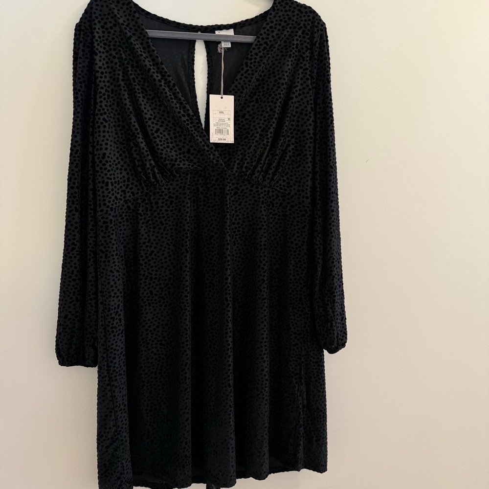 Black stretchy midi dress with velvet polka dots, keyhole on back.